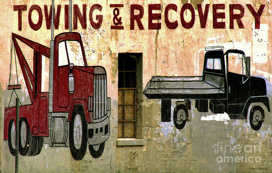 Rustic Towing and Recovery Sign Photograph by Debbie Portwood