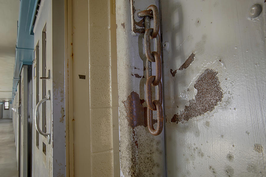 Rusty chains on prison cell door Photograph by Karen Foley
