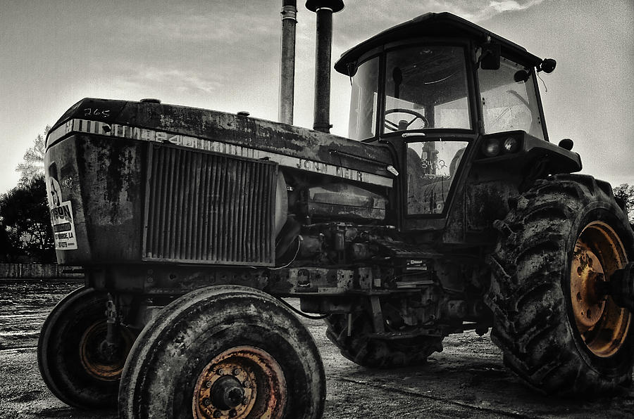Rusty Yellow-Rimmed Tractor Photograph by Eugene Campbell