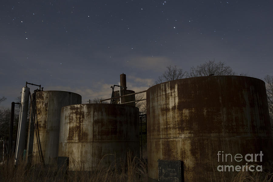 Rusty Oil field tanks Photograph by Keith Kapple