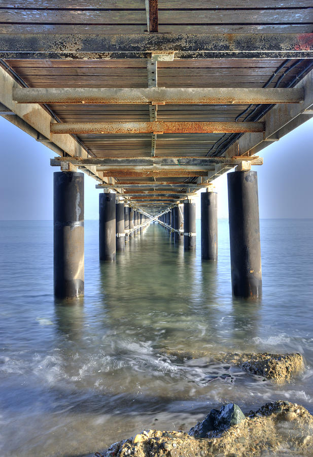 Rusty Pier on the ocean Photograph by Michalakis Ppalis