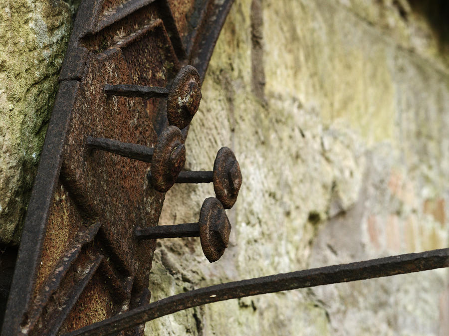 Rusty Pins On Old Water Mill Photograph by Adrian Wale