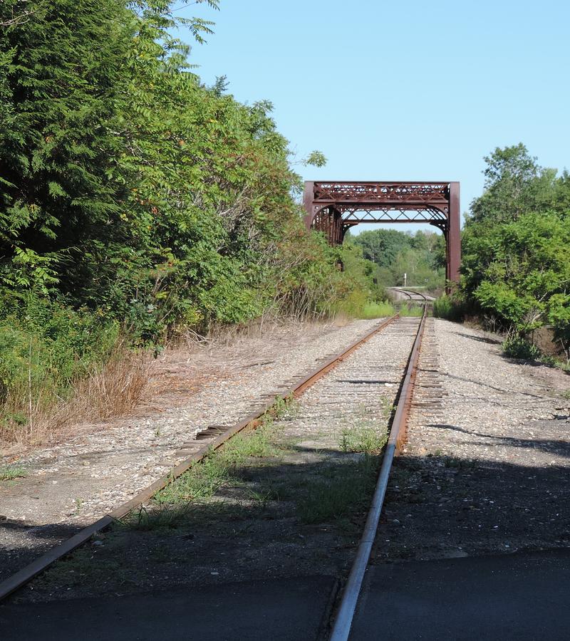 Rusty Rails and Bridge Photograph by Bill Tomsa