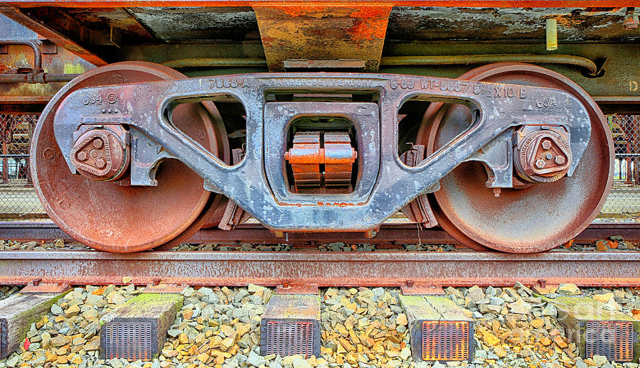 Transportation Photograph - Rusty Wheels by Paul Fell
