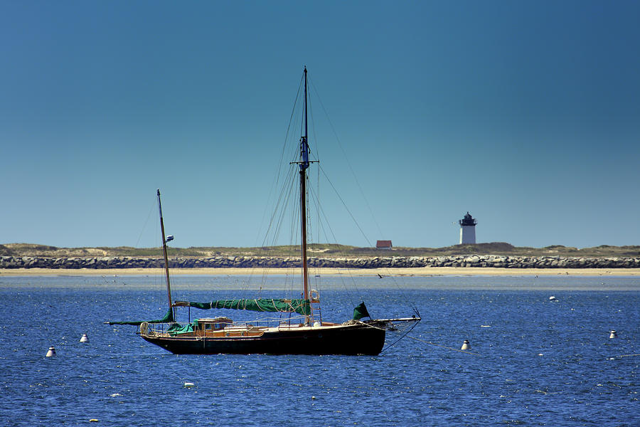 Sailboat and Long Point Lighthouse Photograph by Darius Aniunas