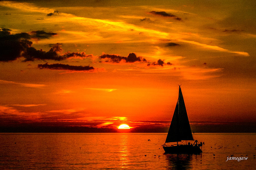 Sailboat at Sunset Photograph by John A Megaw