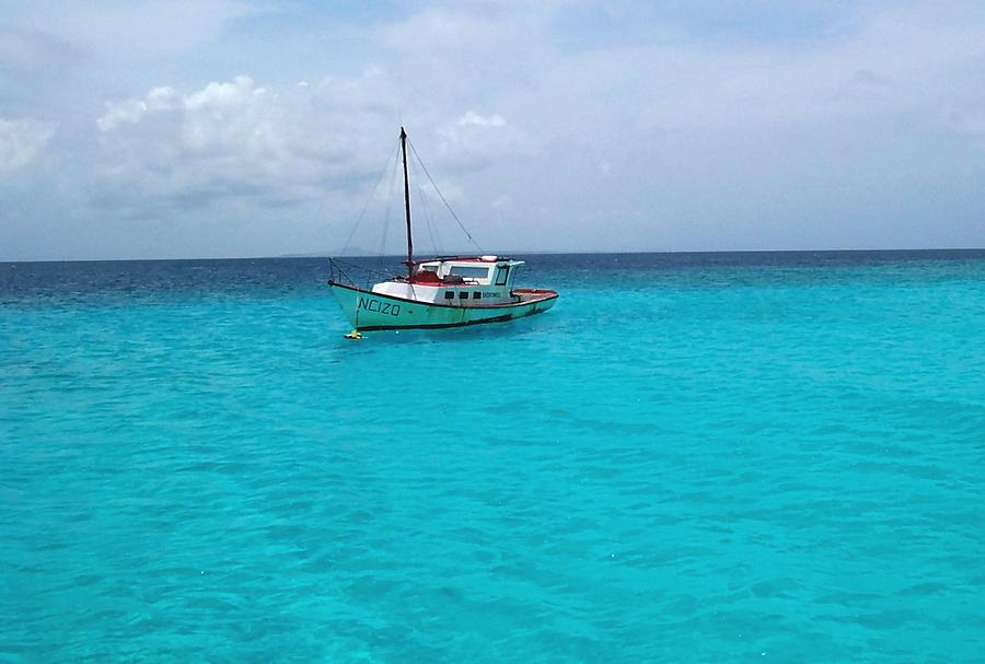 Sailboat Drifting in the Caribbean Azure Sea Photograph by Amy McDaniel