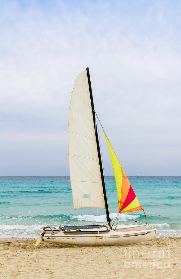 Sailboat on the beach Photograph by Les Palenik