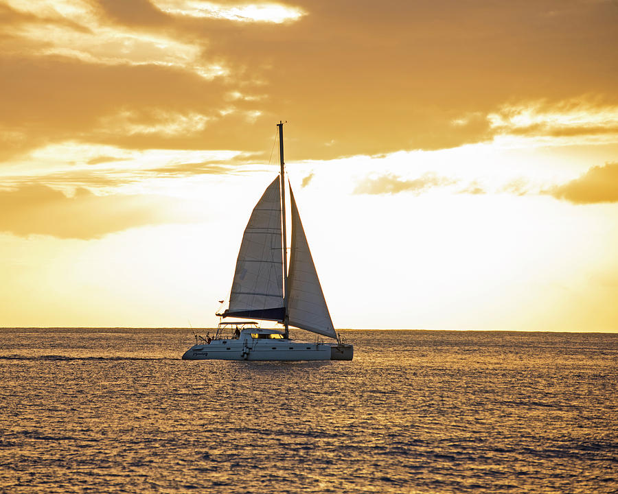 Sailboat sailing off of Anse Chastanet at Sunset Saint Lucia Caribbean  Photograph by Toby McGuire