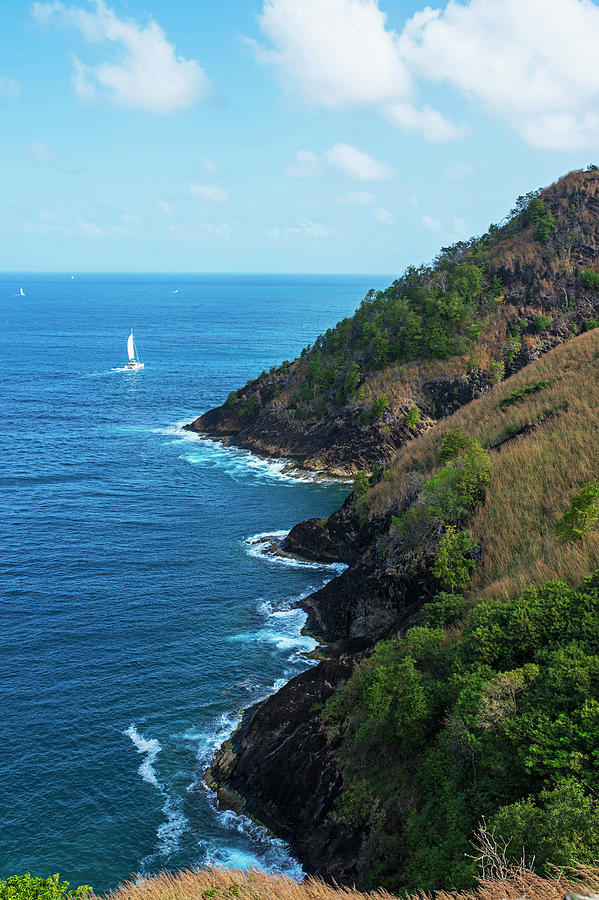 Sailboat sailng around Pigeon Island Saint Lucia Caribbean Photograph by Toby McGuire