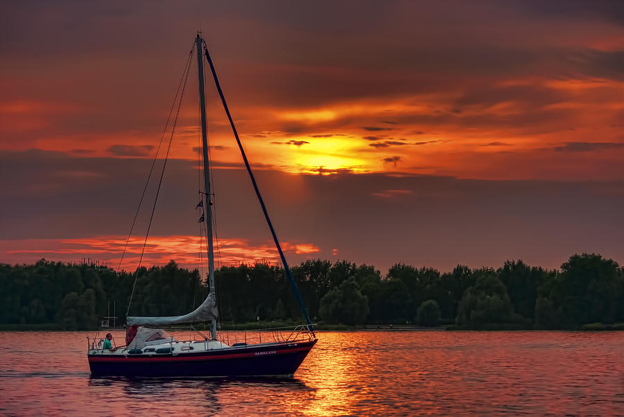 Sailboat Sunset Photograph by Nadia Sanowar