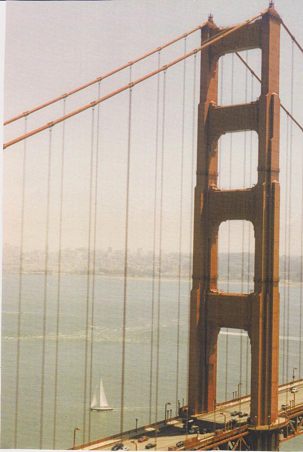 Sailboat under Golden Gate Photograph by Mia Alexander