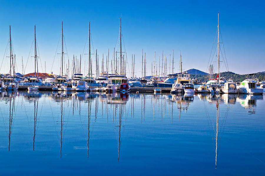 Sailboats and yachts in harbor reflections view Photograph by Brch Photography