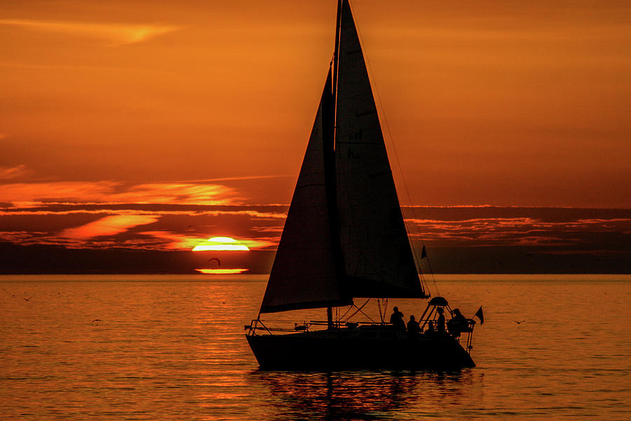 Sailing At A Red Sunset Photograph by John A Megaw