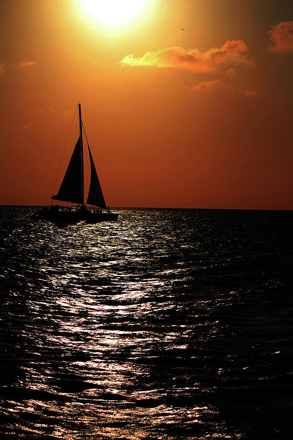 Sailing into the sunset Photograph by Kevin Banker