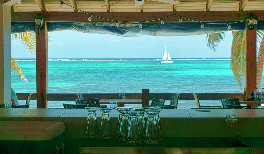 Sailing past a bar Ambergris Caye, Belize Photograph by Waterdancer
