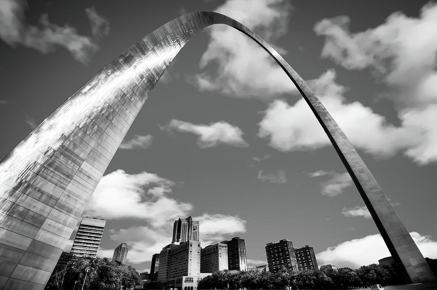 Black And White Photograph - Saint Louis Skyline Arch and Puffy Clouds - Black and White by Gregory Ballos