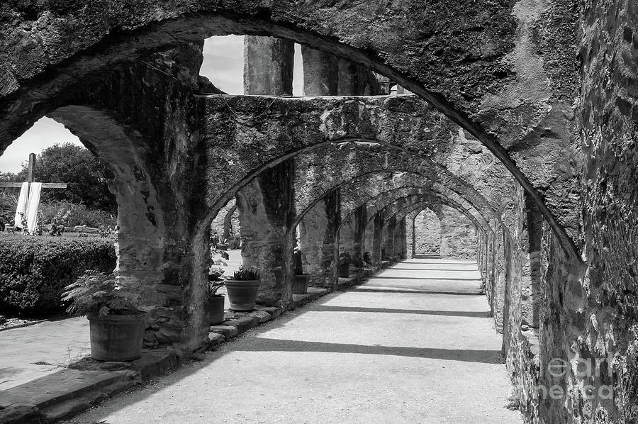 San Antonio Mission arches in black and white Photograph by Paul Quinn