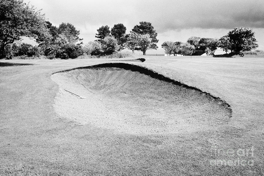 Golf Photograph - sand bunker with a view of the pin at Cushendall golf club County Antrim Northern Ireland UK by Joe Fox