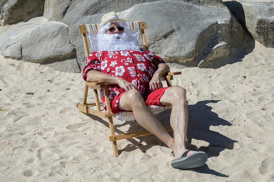 Santa Claus on sunny beach in chair Photograph by Karen Foley
