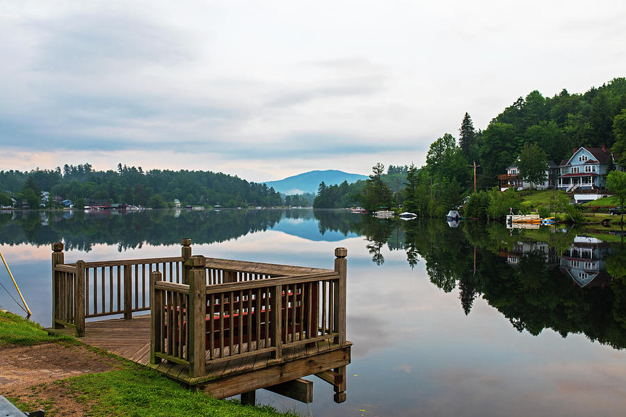 Saranac Lake Wooden Deck Reflection on the Calm Lake Photograph by Toby McGuire