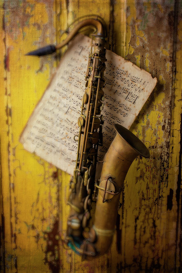 Saxophone Hanging On Old Wall Photograph by Garry Gay