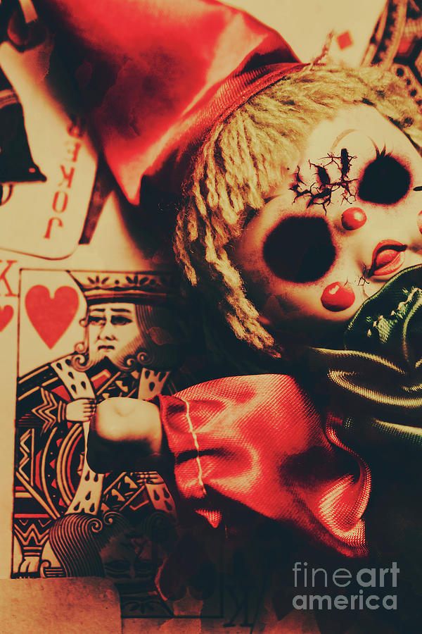 Scary Doll Dressed As Joker On Playing Card Photograph