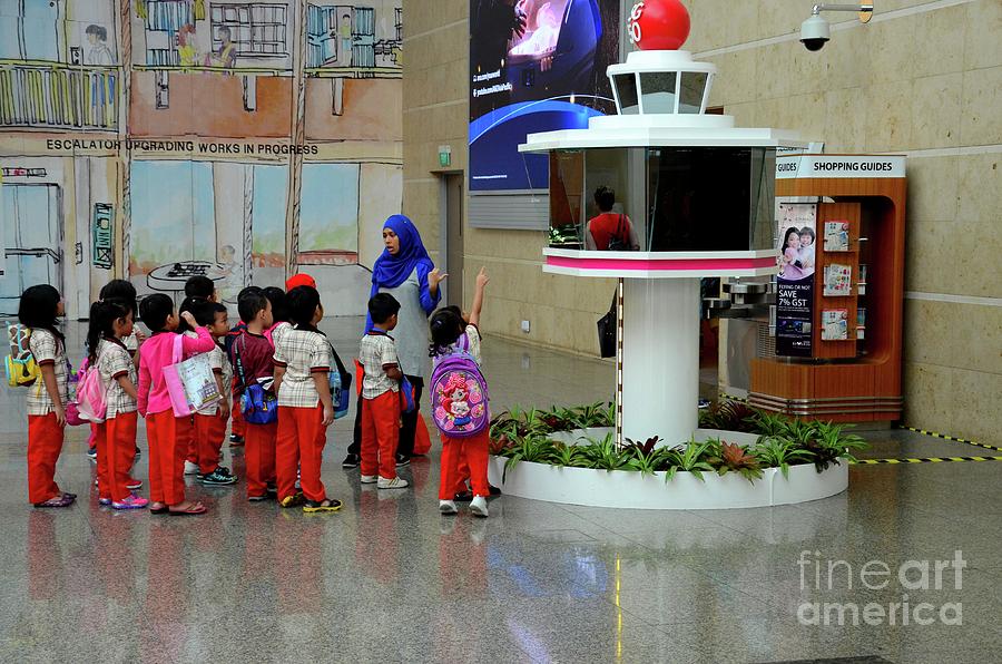 Schoolchildren on field trip with teacher to Changi airport Singapore Photograph by Imran Ahmed