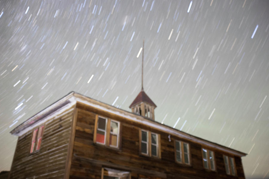 Schoolhouse blurred and illuminated in Bodie, California at nigh Photograph by Karen Foley