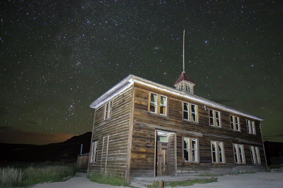 Schoolhouse illuminated in Bodie, California at night Photograph by Karen Foley