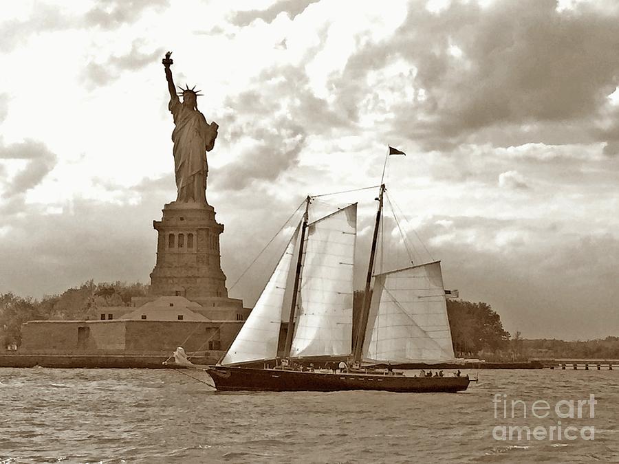 Schooner at Statue of Liberty, New York Harbor. Photograph by Tom Wurl