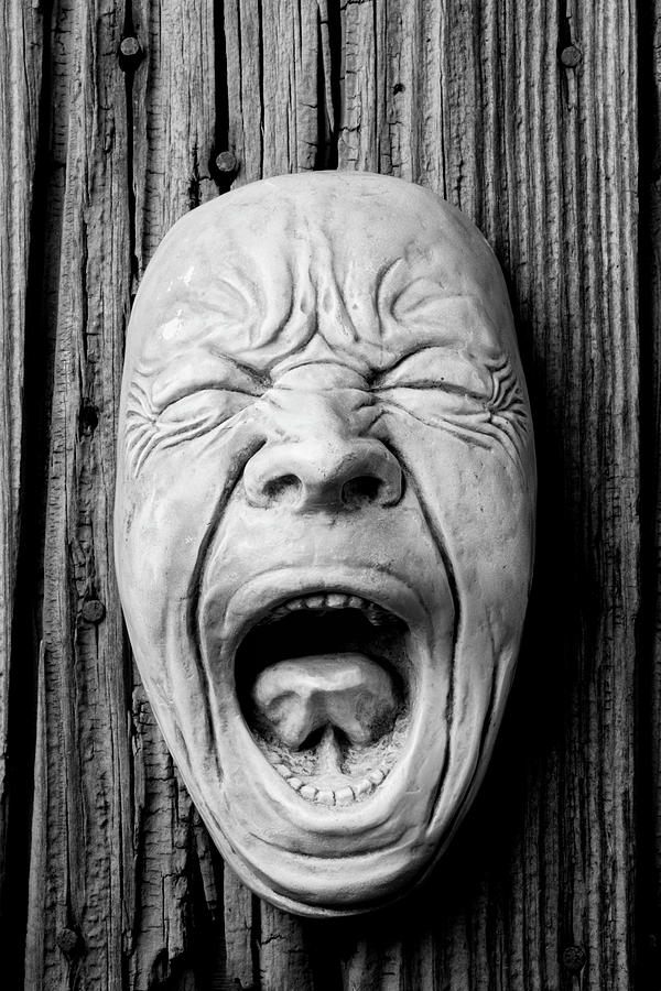 Black And White Photograph - Screaming Face On Wood Wall by Garry Gay