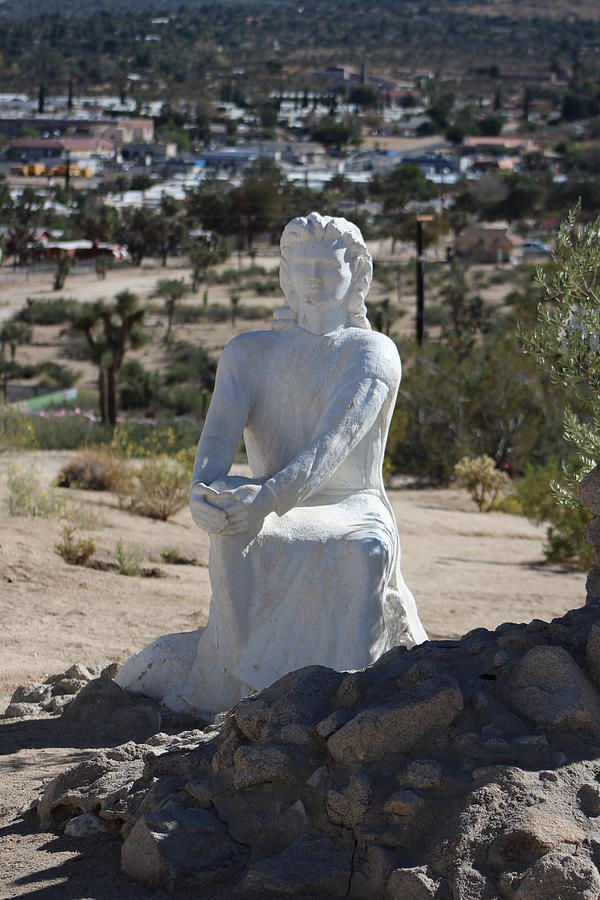 Sculpture of Jesus Sitting in Desert Christ Park Photograph by Colleen Cornelius