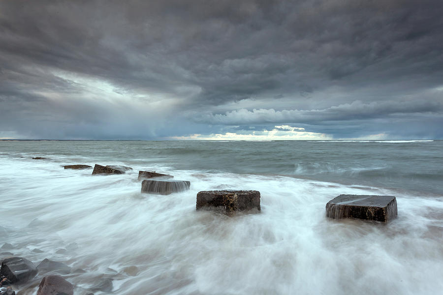 Sea defenses at high tide Photograph by Anita Nicholson