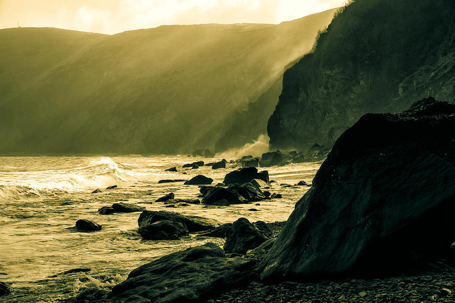 Sea Fret on Lynmouth Beach in shades of yellow. Photograph by John Paul Cullen