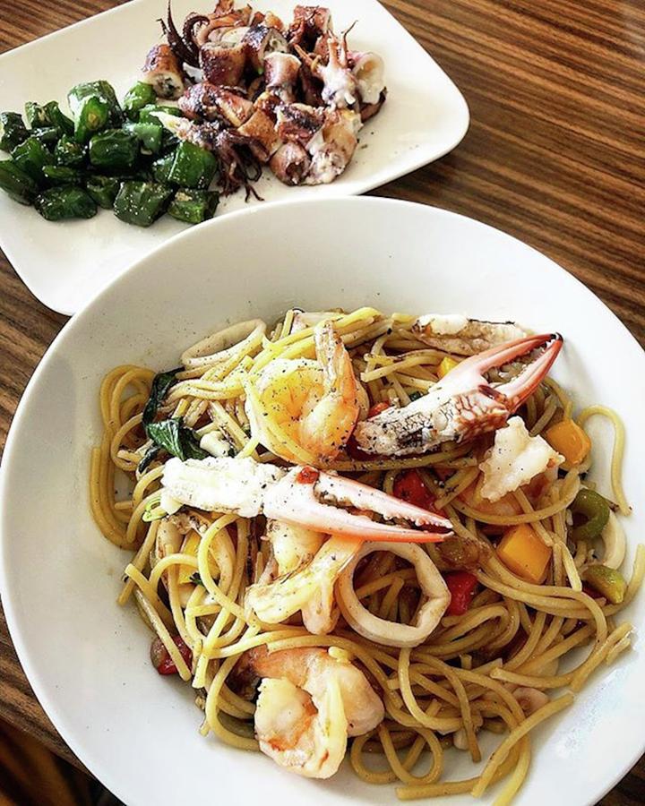 Seafood Spaghetti And Grilled Octopus Photograph by Arya Swadharma