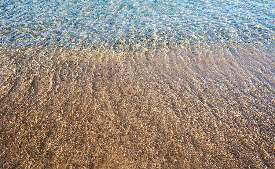 Seashore clear water with sandy beach for  background Photograph by Michalakis Ppalis