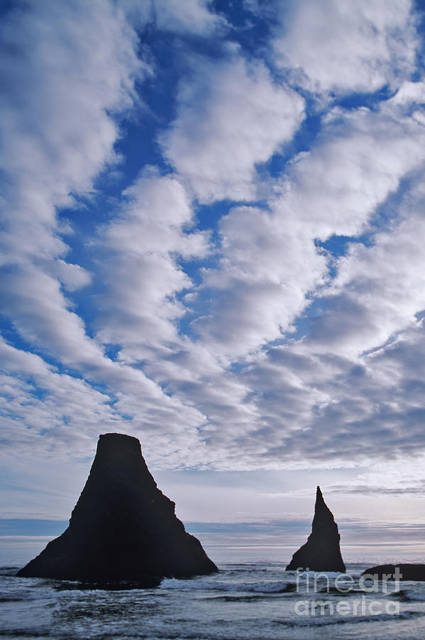 Seastacks and Rolling Clouds Photograph by Dennis Flaherty