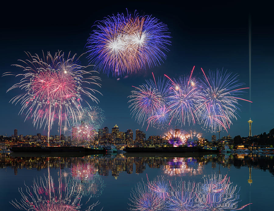 Seattle skyline and fireworks with reflections Photograph by William Lee