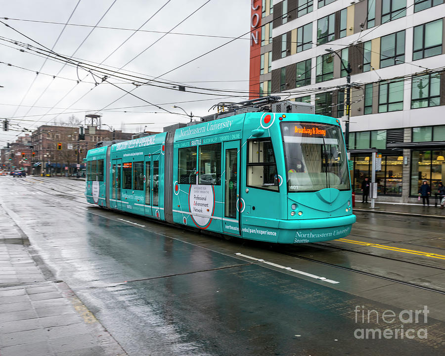 Seattle Streetcar In Northeastern University Wrap Thru The Rain Photograph