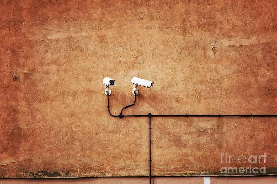 Security cameras on wall. Photograph by Sophie McAulay