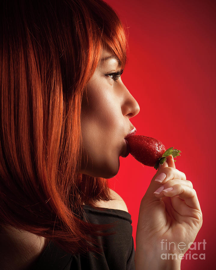 Seductive woman eating strawberry Photograph by Anna Om