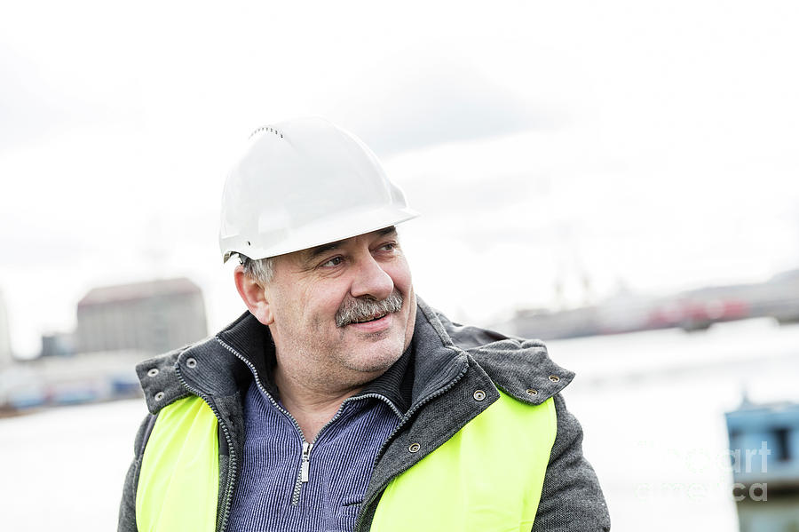 Senior engineer builder at the construction site. Photograph by Michal Bednarek