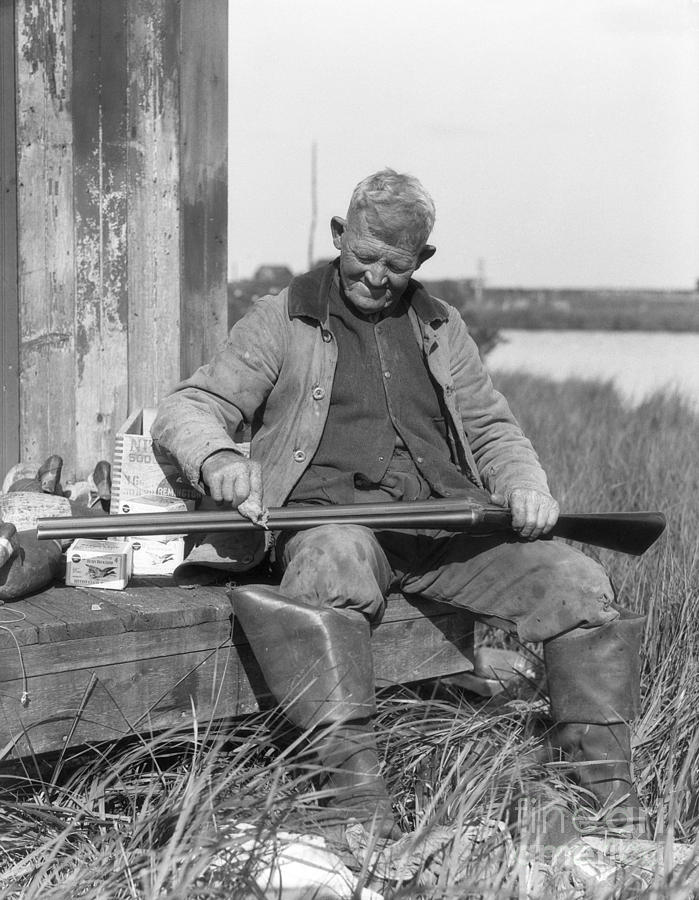 Duck Photograph - Senior Man Cleaning Shotgun, C.1920-30s by H. Armstrong Roberts/ClassicStock
