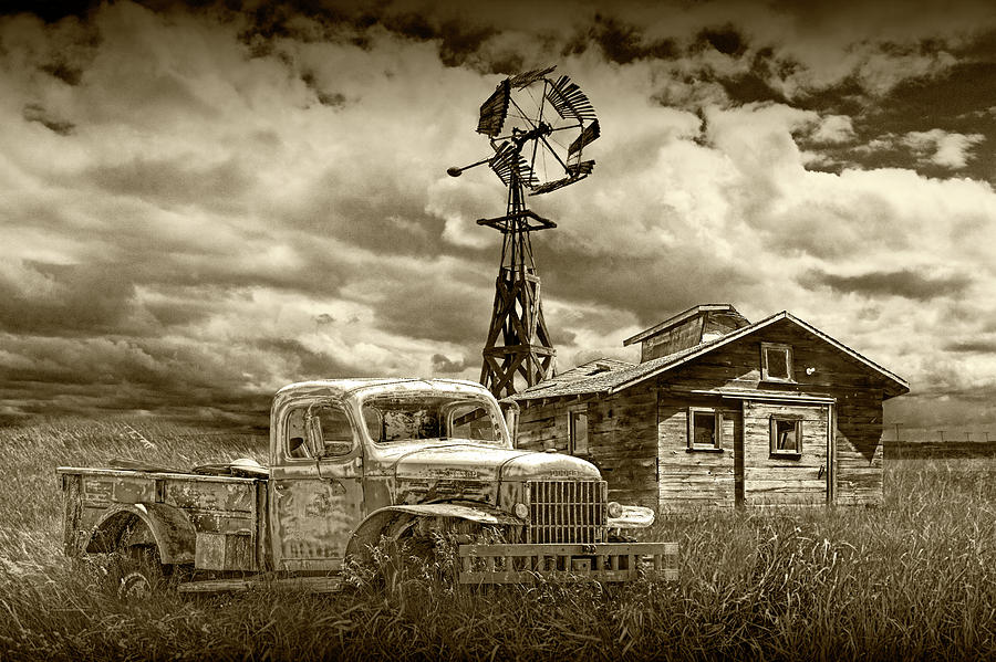 Sepia Tone of Old Vintage Junk Dodge Pickup and Decaying Barn with Windmill Photograph by Randall Nyhof