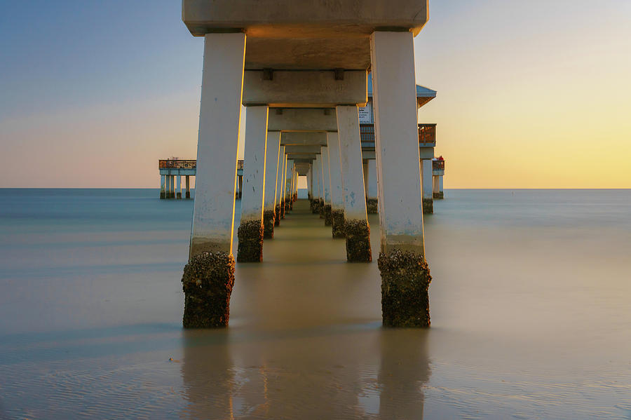 Serenity Under the Pier Photograph by Mark Rogers