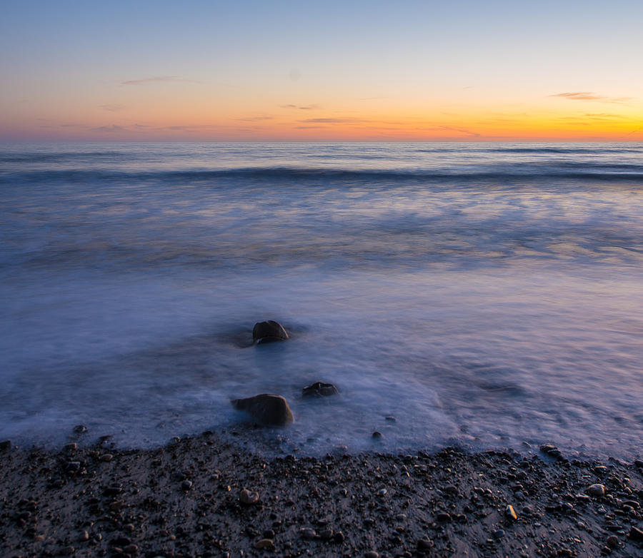 Setting Sun Over The Ocean Photograph by Richard Cheski
