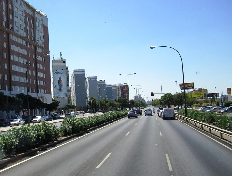 Seville High Rise Buildings Along the Highway Spain Photograph by John Shiron