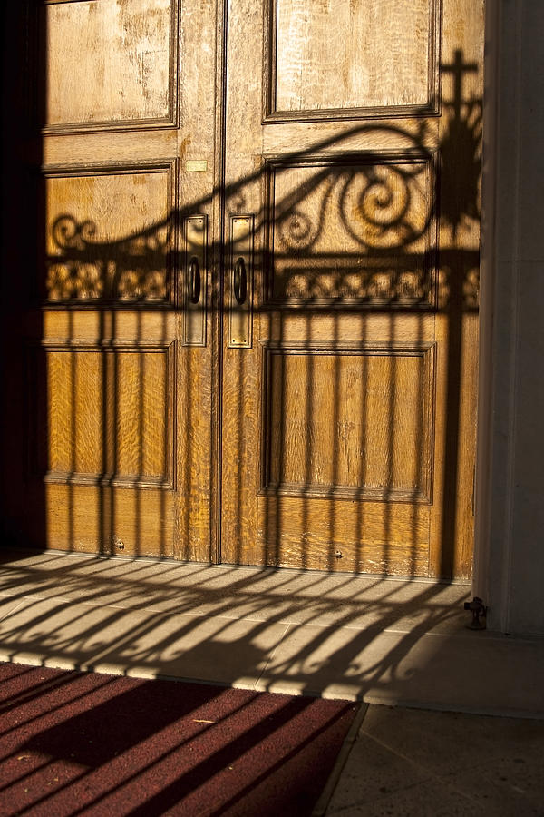 Shadows on a wood door Photograph by Sven Brogren