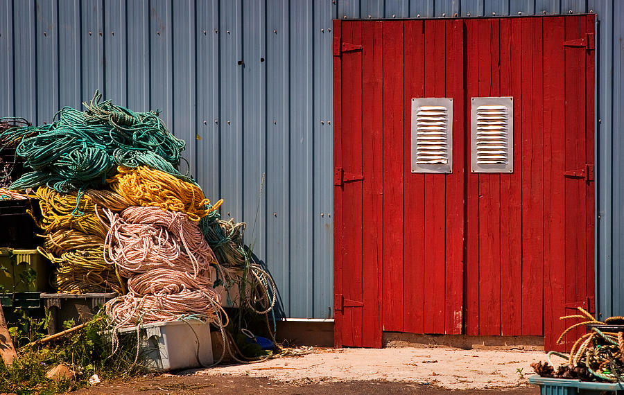 Shed doors and tangled nets Photograph by Louise Heusinkveld